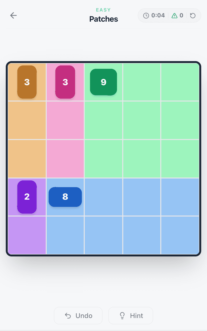 The solved 5×5 Patches board: a 3×3 square, two tall strips of three, one tall strip of two and a 4×2 rectangle covering every cell.